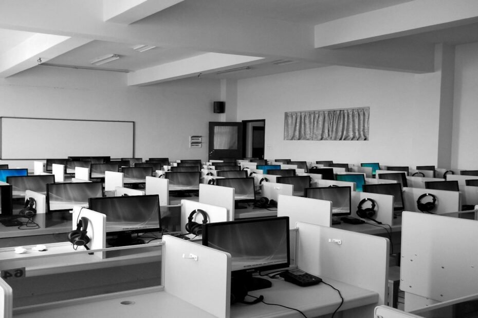 gray wooden computer cubicles inside room